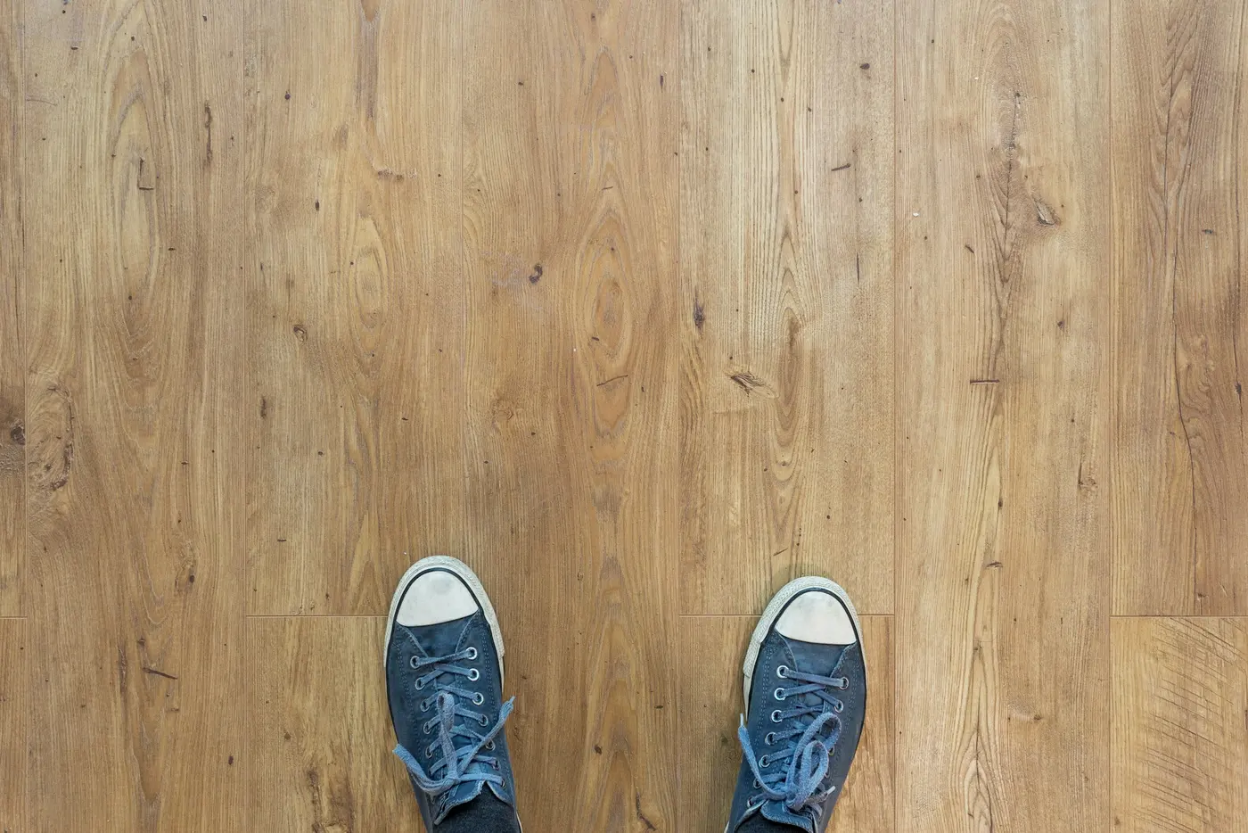 Light oak-look vinyl plank floor at foot level